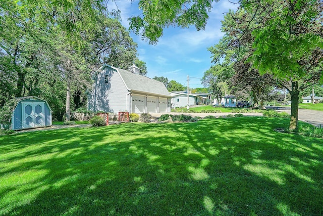 108 1st St, Kenyon, MN 55946 - view of grassy yard with a garage