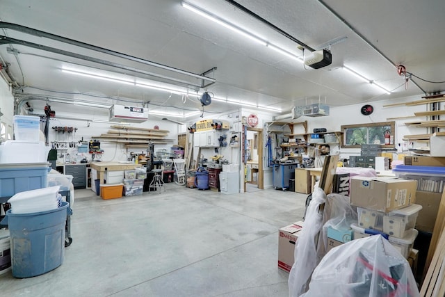 108 1st St, Kenyon, MN 55946 - garage featuring a workshop area and a garage door opener