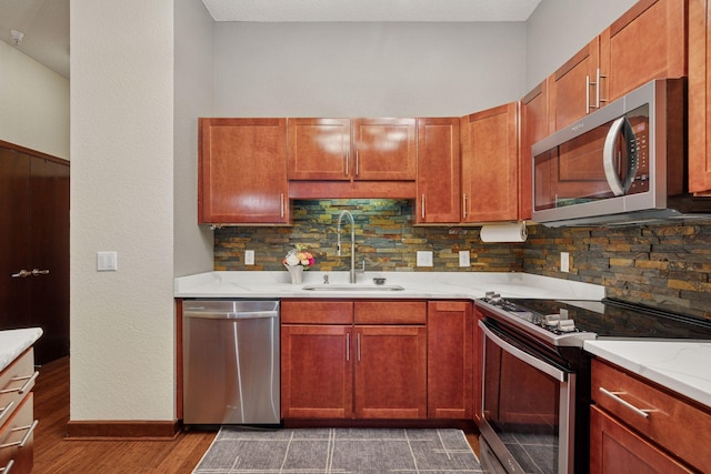 308 18th St Unit 202, Minneapolis, MN 55404 - kitchen featuring stainless steel appliances, wood finished floors, and tasteful backsplash