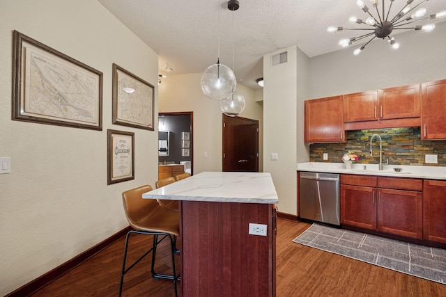 308 18th St Unit 202, Minneapolis, MN 55404 - kitchen with stainless steel dishwasher, decorative backsplash, dark wood-type flooring, a kitchen breakfast bar, and a center island