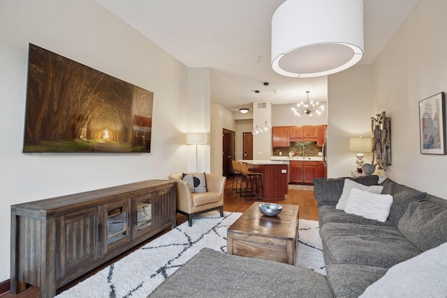 308 18th St Unit 202, Minneapolis, MN 55404 - living area featuring light wood-style flooring and a chandelier