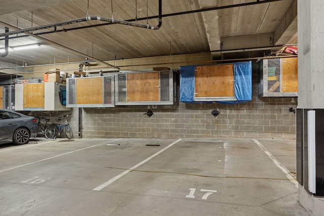 308 18th St Unit 202, Minneapolis, MN 55404 - parking deck featuring concrete block wall