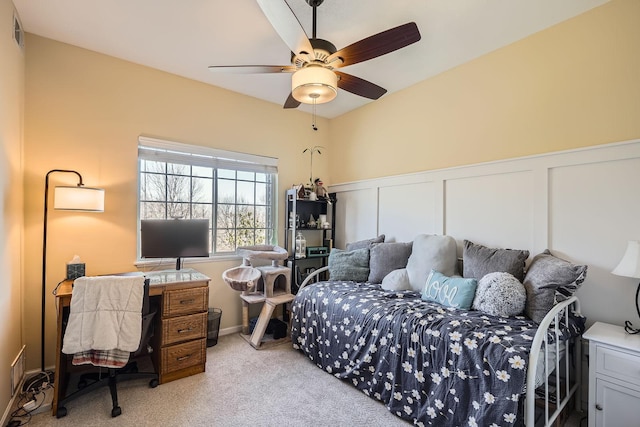 12693 Collegeview Dr Unit 201, Eden Prairie, MN 55347 - bedroom with light colored carpet, a decorative wall, wainscoting, and ceiling fan