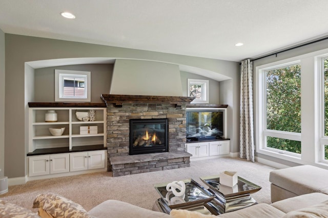 3365 Osgood Way N, Baytown Twp, MN 55082 - living room featuring light colored carpet, a stone fireplace, and recessed lighting