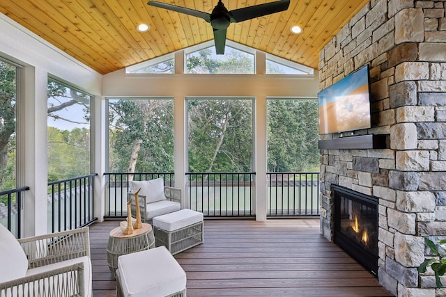 3365 Osgood Way N, Baytown Twp, MN 55082 - sunroom with a stone fireplace, a ceiling fan, lofted ceiling, and healthy amount of natural light