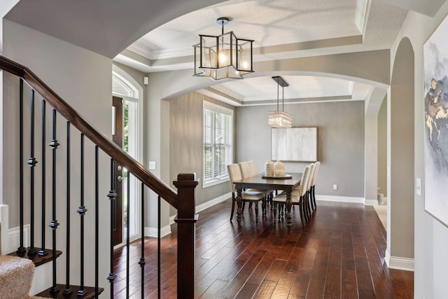 3365 Osgood Way N, Baytown Twp, MN 55082 - dining room featuring a tray ceiling, dark wood-style floors, stairway, crown molding, and a chandelier