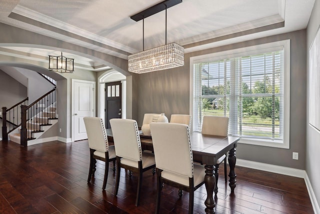 3365 Osgood Way N, Baytown Twp, MN 55082 - dining space featuring arched walkways, stairs, a raised ceiling, a chandelier, and ornamental molding