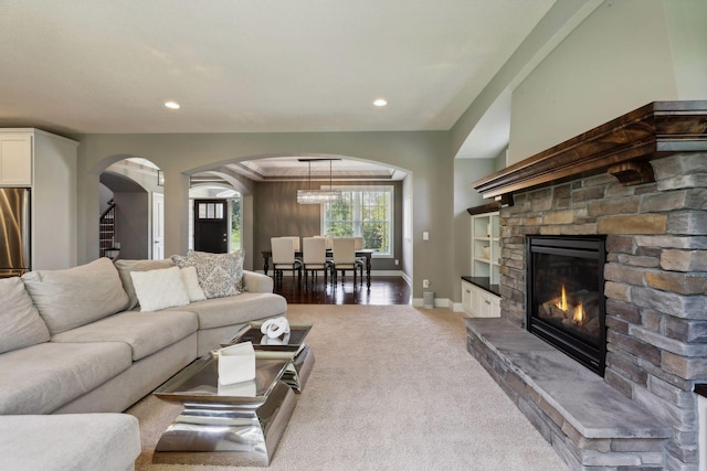 3365 Osgood Way N, Baytown Twp, MN 55082 - carpeted living room with arched walkways, recessed lighting, and a fireplace