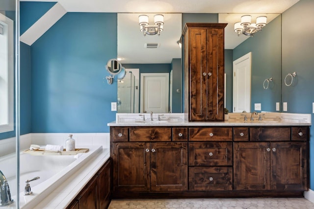 3365 Osgood Way N, Baytown Twp, MN 55082 - full bath with double vanity, a garden tub, and a chandelier
