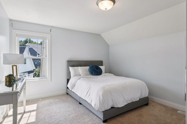 3365 Osgood Way N, Baytown Twp, MN 55082 - carpeted bedroom featuring baseboards and vaulted ceiling