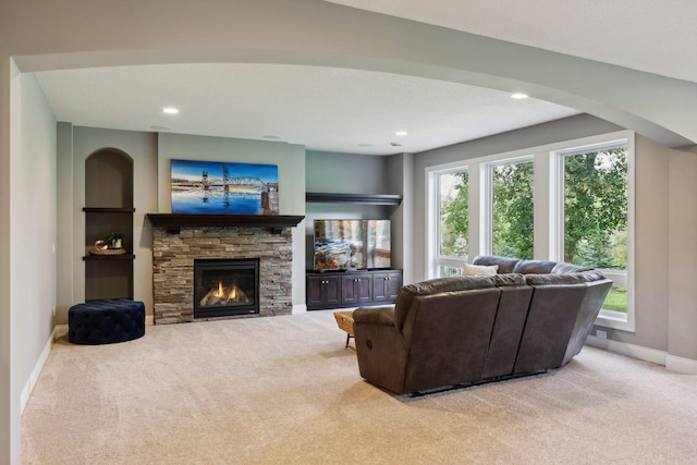 3365 Osgood Way N, Baytown Twp, MN 55082 - living room with carpet, healthy amount of natural light, a stone fireplace, recessed lighting, and arched walkways