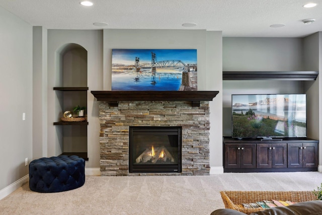 3365 Osgood Way N, Baytown Twp, MN 55082 - living area featuring carpet flooring, a stone fireplace, a textured ceiling, and recessed lighting