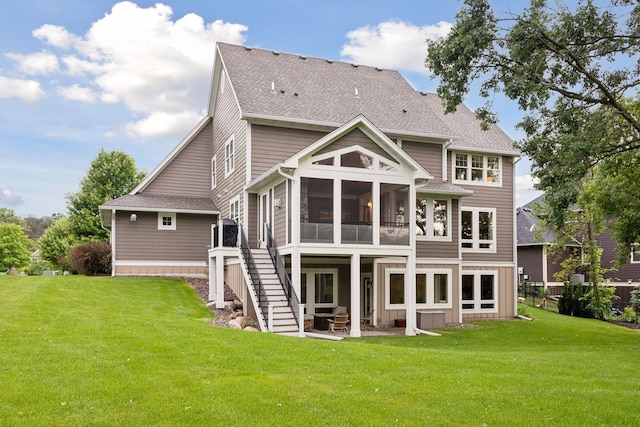 3365 Osgood Way N, Baytown Twp, MN 55082 - back of property with a sunroom, a yard, a patio, and a shingled roof