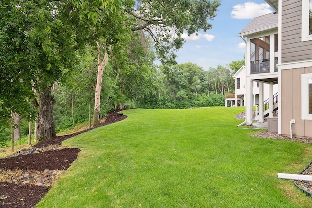 3365 Osgood Way N, Baytown Twp, MN 55082 - view of grassy yard featuring stairway and a sunroom