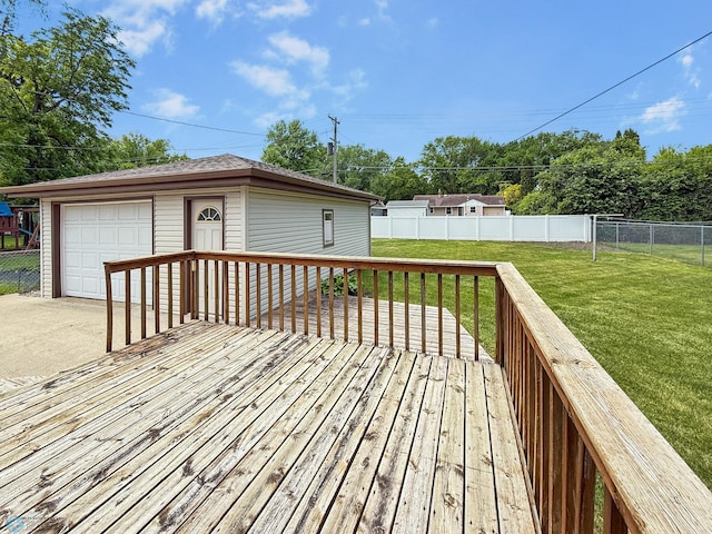1737 14 1/2 St S, Fargo, ND 58103 - wooden terrace with a garage, a fenced backyard, an outbuilding, and concrete driveway