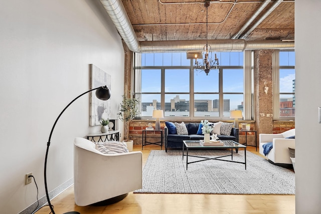 521 7th St Unit 420, Minneapolis, MN 55415 - living room featuring a chandelier, wood finished floors, and a view of city