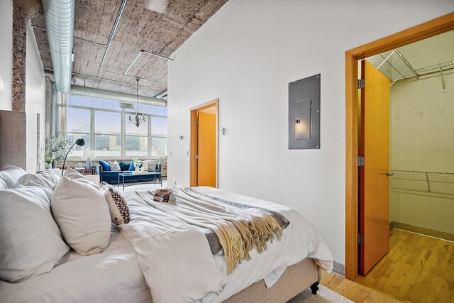 521 7th St Unit 420, Minneapolis, MN 55415 - bedroom featuring electric panel and wood finished floors