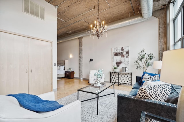 521 7th St Unit 420, Minneapolis, MN 55415 - living area featuring wood finished floors and a chandelier