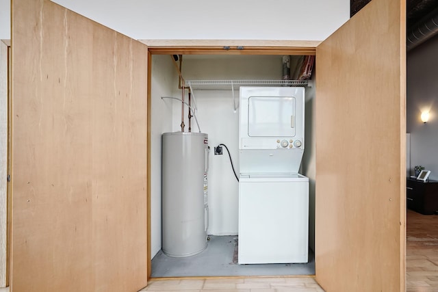 521 7th St Unit 420, Minneapolis, MN 55415 - washroom with stacked washer and clothes dryer and electric water heater