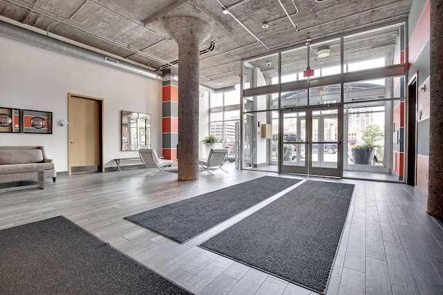 521 7th St Unit 420, Minneapolis, MN 55415 - building lobby featuring a high ceiling and a wall of windows