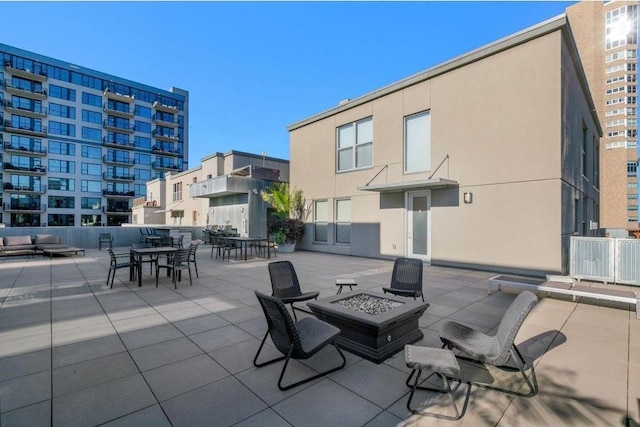 521 7th St Unit 420, Minneapolis, MN 55415 - view of patio featuring an outdoor living space with a fire pit and outdoor dining area