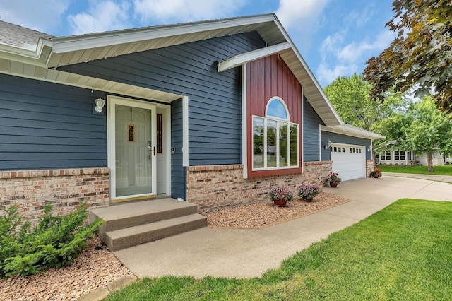 1213 4 1/2 Ave N, Sauk Rapids, MN 56379 - view of exterior entry with brick siding, driveway, and a garage