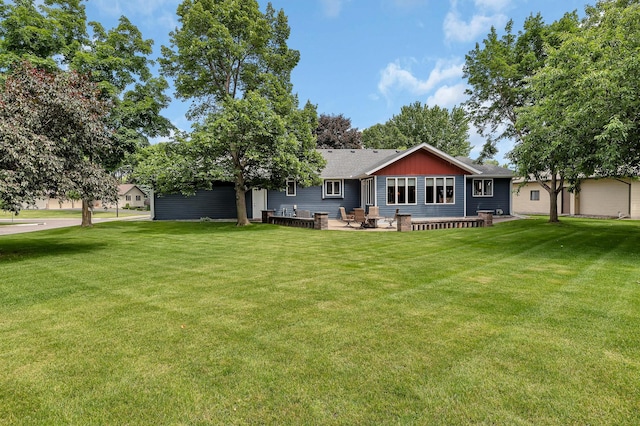 1213 4 1/2 Ave N, Sauk Rapids, MN 56379 - back of property with a yard and roof with shingles
