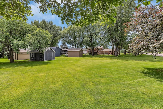 1213 4 1/2 Ave N, Sauk Rapids, MN 56379 - view of grassy yard featuring a storage unit
