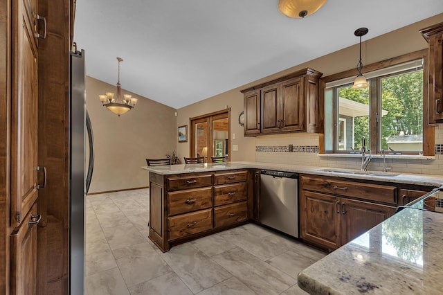 1213 4 1/2 Ave N, Sauk Rapids, MN 56379 - kitchen featuring stainless steel appliances, a peninsula, vaulted ceiling, decorative backsplash, and light stone countertops