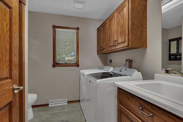 1213 4 1/2 Ave N, Sauk Rapids, MN 56379 - laundry room with washer and dryer and light tile patterned flooring