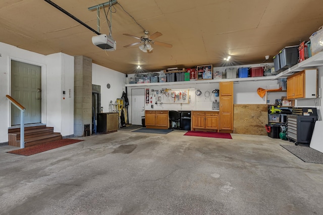 1213 4 1/2 Ave N, Sauk Rapids, MN 56379 - garage featuring a garage door opener, a workshop area, and ceiling fan