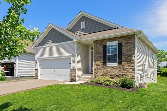 256 16th Ave SE, Lonsdale, MN 55046 - view of front facade featuring stone siding, an attached garage, driveway, and a front lawn