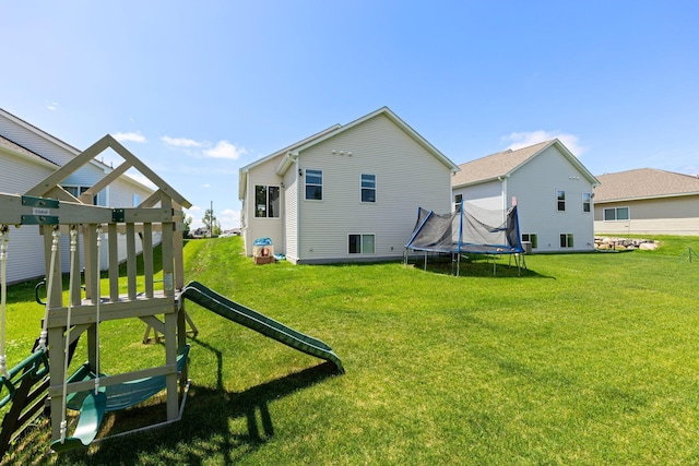 256 16th Ave SE, Lonsdale, MN 55046 - view of green lawn with a trampoline
