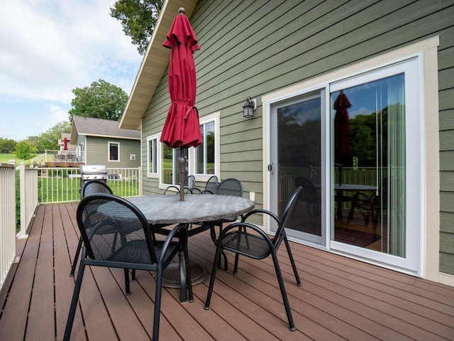 30424 410th Street Unit 4 (Share 3) - Cic #65, Dent, MN 56528 - wooden deck with outdoor dining space and a grill