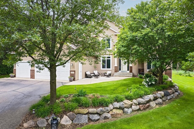 18250 221st Ave NW, Big Lake, MN 55309 - obstructed view of property featuring asphalt driveway, a front yard, and entry steps