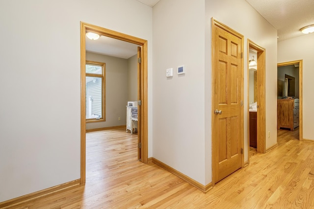18250 221st Ave NW, Big Lake, MN 55309 - corridor featuring light wood-style flooring and baseboards