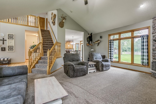 18250 221st Ave NW, Big Lake, MN 55309 - living area featuring stairway, carpet floors, plenty of natural light, and high vaulted ceiling