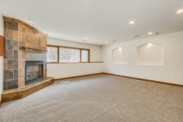 18250 221st Ave NW, Big Lake, MN 55309 - unfurnished living room featuring carpet, recessed lighting, and a tile fireplace