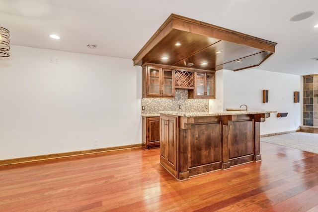 18250 221st Ave NW, Big Lake, MN 55309 - indoor wet bar featuring light wood-style flooring, decorative backsplash, and recessed lighting
