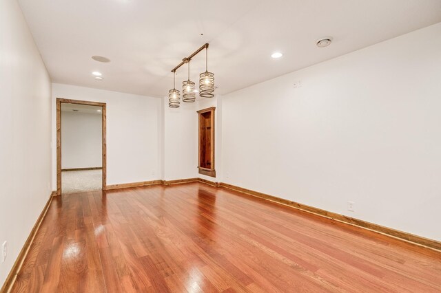 18250 221st Ave NW, Big Lake, MN 55309 - spare room featuring wood finished floors, recessed lighting, and a smoke detector