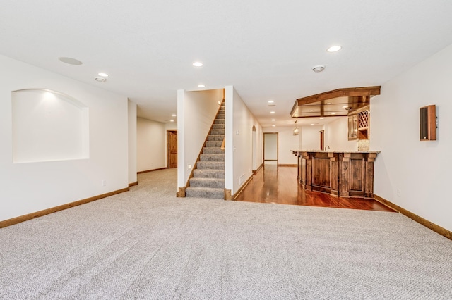 18250 221st Ave NW, Big Lake, MN 55309 - carpeted living room featuring bar with sink, recessed lighting, and stairs