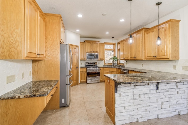 18250 221st Ave NW, Big Lake, MN 55309 - kitchen featuring appliances with stainless steel finishes, a peninsula, a breakfast bar, dark stone countertops, and light tile patterned flooring