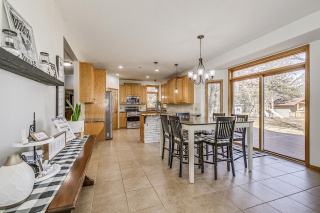 18250 221st Ave NW, Big Lake, MN 55309 - dining area featuring a chandelier, light tile patterned floors, and recessed lighting