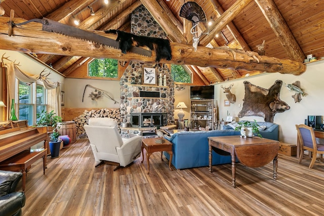 15015 Held Cir, Cold Spring, MN 56320 - living room with a wood ceiling with exposed beams, wood finished floors, a stone fireplace, high vaulted ceiling, and a chandelier