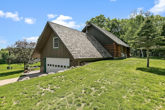 15015 Held Cir, Cold Spring, MN 56320 - view of property exterior with a lawn, log siding, and a detached garage