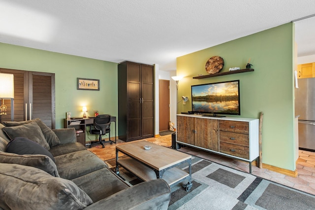 333 8th St SE Unit 120, Minneapolis, MN 55414 - living room featuring a desk and a textured ceiling