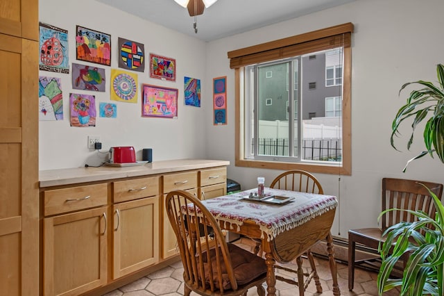 333 8th St SE Unit 120, Minneapolis, MN 55414 - dining space featuring a baseboard heating unit and ceiling fan