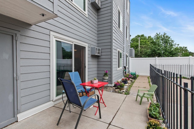 333 8th St SE Unit 120, Minneapolis, MN 55414 - view of patio featuring an AC wall unit