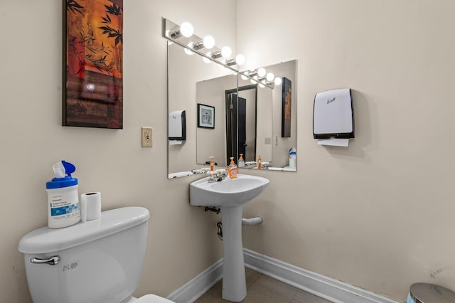 333 8th St SE Unit 120, Minneapolis, MN 55414 - half bath featuring toilet and tile patterned floors
