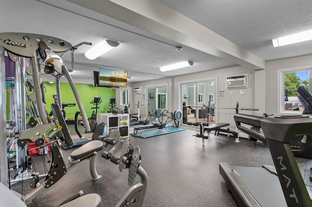 333 8th St SE Unit 120, Minneapolis, MN 55414 - workout area with an AC wall unit and a textured ceiling
